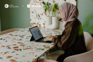 Image of a woman working on a laptop