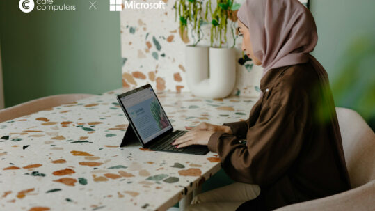 Image of a woman working on a laptop