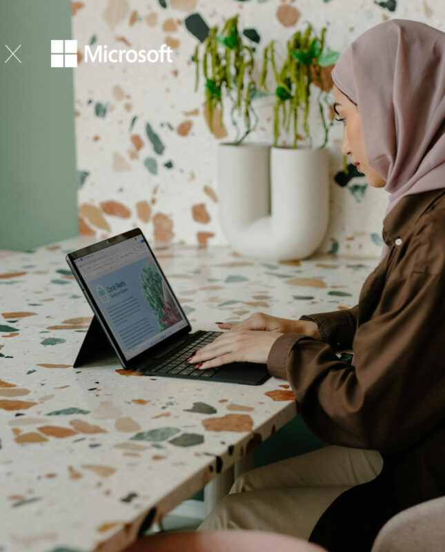 Image of a woman working on a laptop