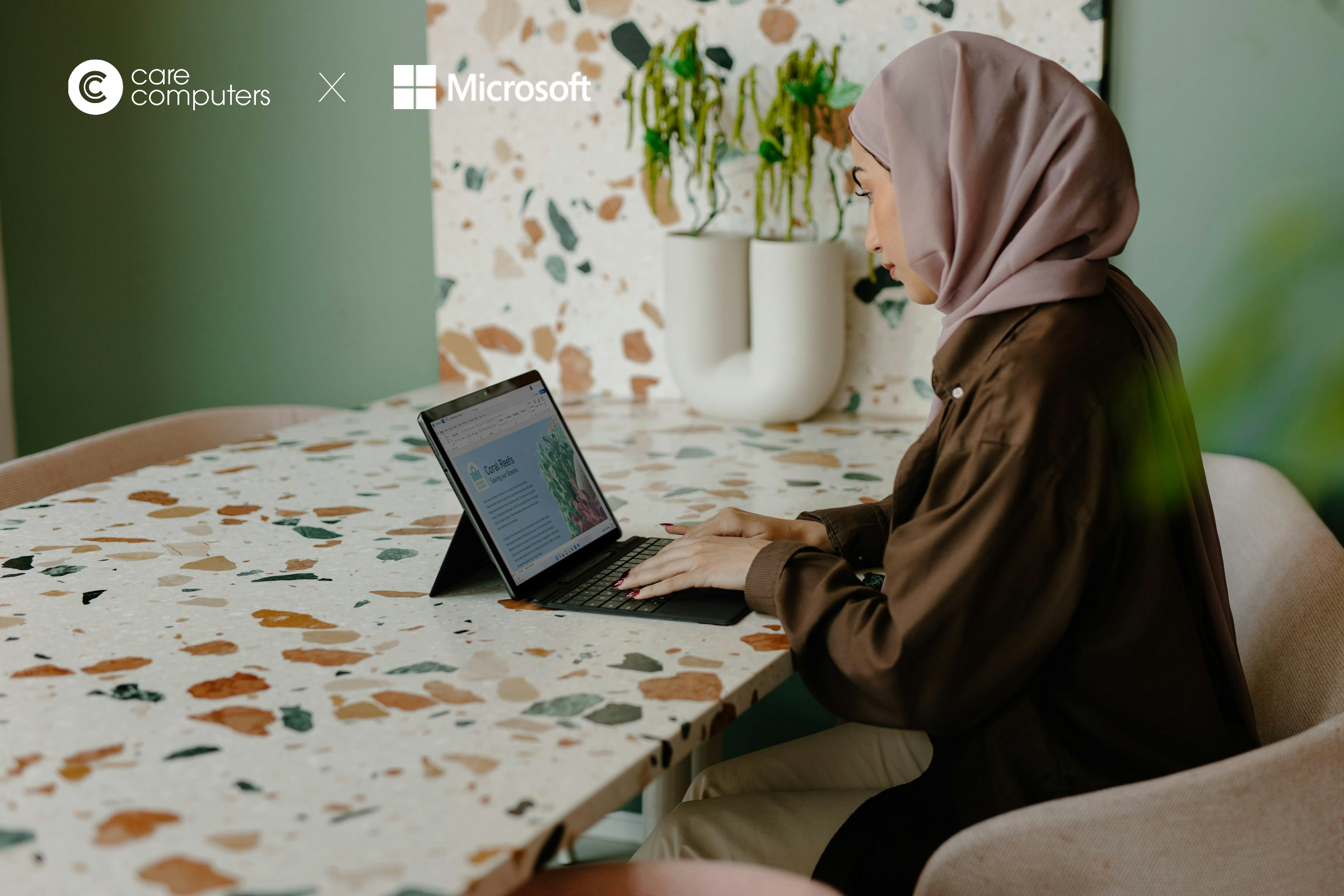 Image of a woman working on a laptop